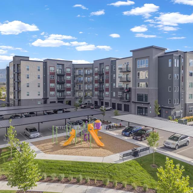 Ember Peaks at American Fork - Exterior View of Amenities like Playground, Parking Space and the Apartment Building