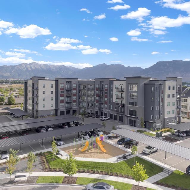 Ember Peaks at American Fork - Exterior View of Amenities like Playground, Parking Space and the Apartment Building